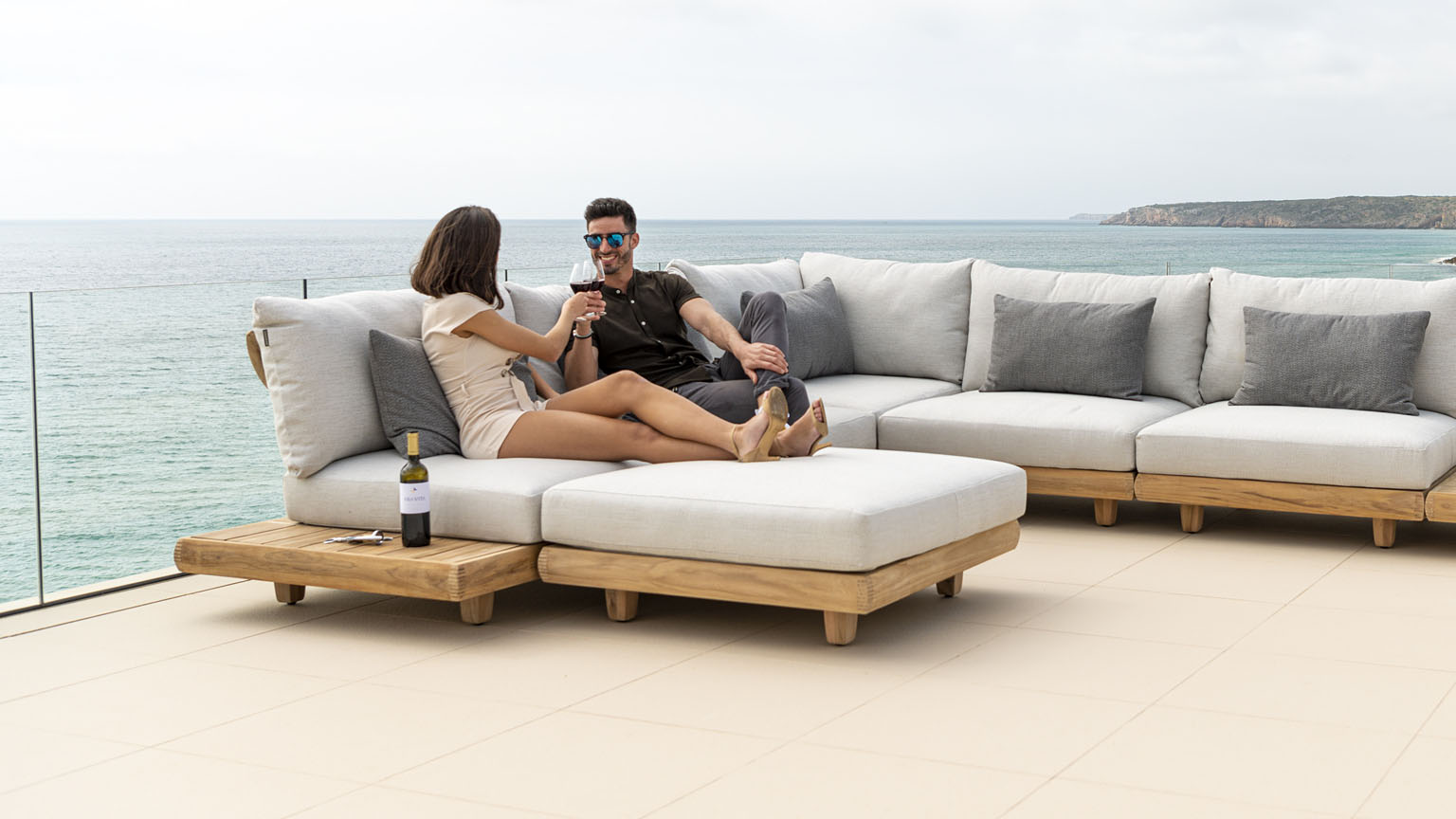 Jensen Sorrento Sectional Pictured in Nurture Pebble and Nurture Smoke People Sitting Together - Teak